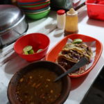 Tacos y consomé de Birria