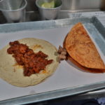 Taco taurino (cecina se res, chicharrón de cerdo, longaniza, en adobo) y Taco de carne asada con cebollitas caramelizadas. @ Tacos Los Alexis